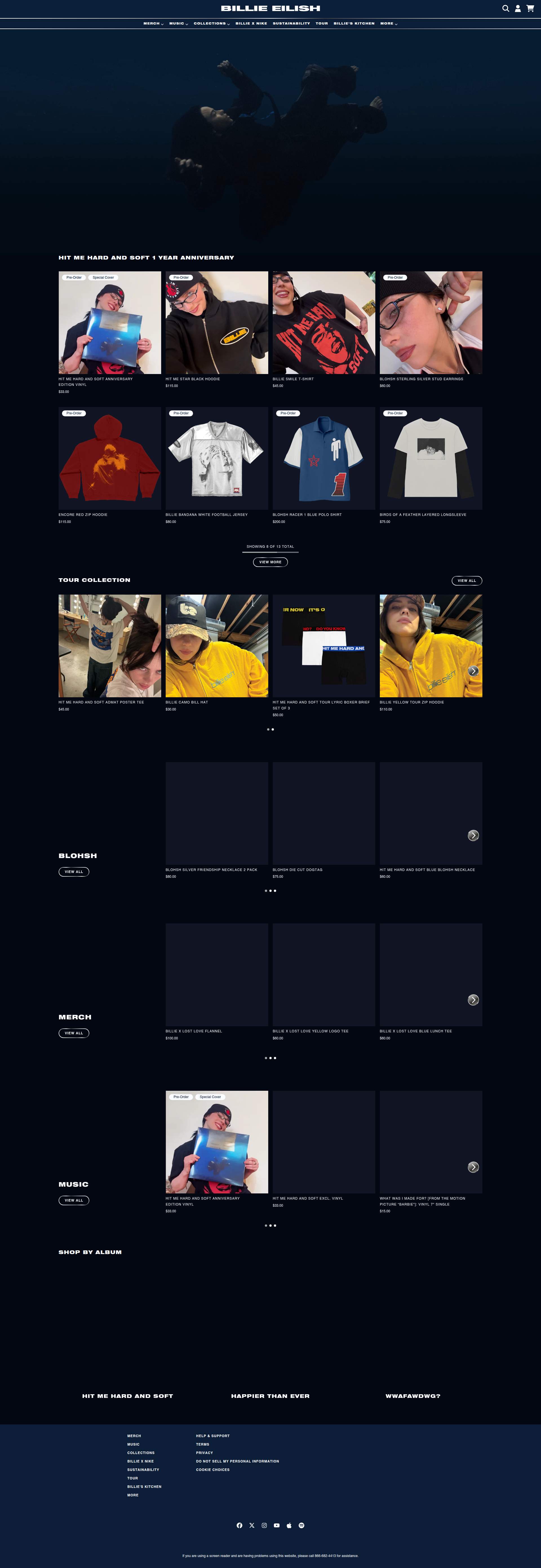 Billie Eilish - This is the homepage of Blue Eilish's official website featuring a dark theme with multiple product sections including anniversary merchandise, tour collection, and various product categories like clothing, music, and accessories displayed in grid layouts.